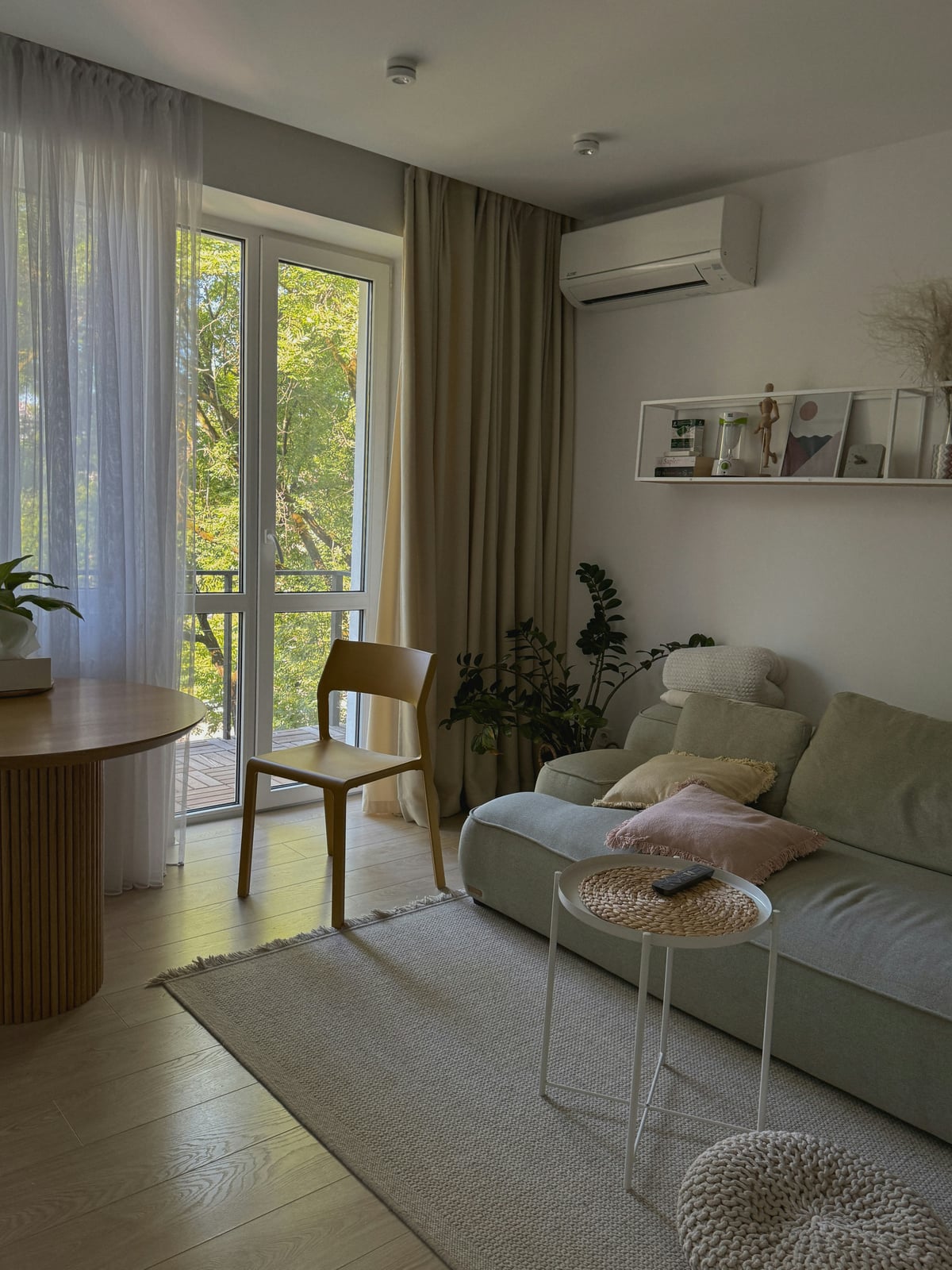 Tranquil living area with sage green accents and natural materials